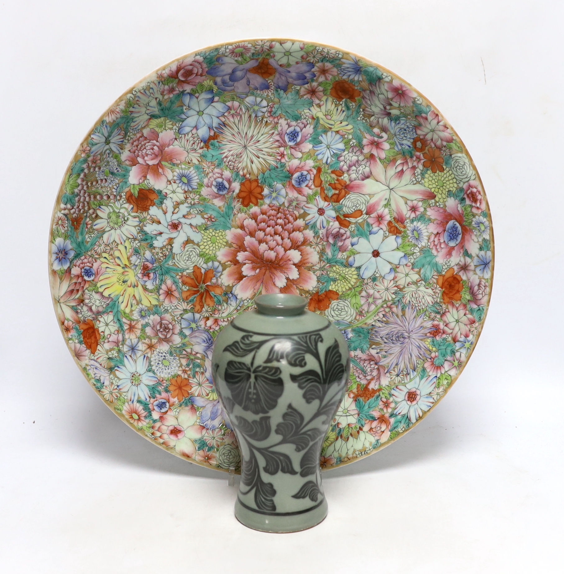 A Chinese millefleur enamelled porcelain dish, six character Qianlong seal mark, but late 19th/early 20th century, 38cm diameter and a Korean celadon vase